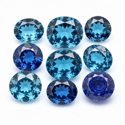 Assortment of vibrant blue gemstones on a clean white background