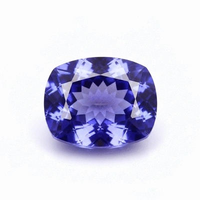 Close-up of a faceted tanzanite gemstone showing its blue-violet color