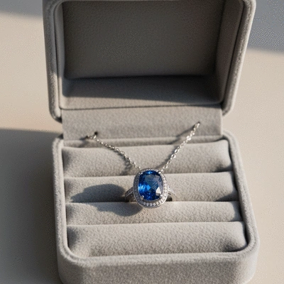 Elegant sapphire ring and necklace stored in a soft-lined jewelry box