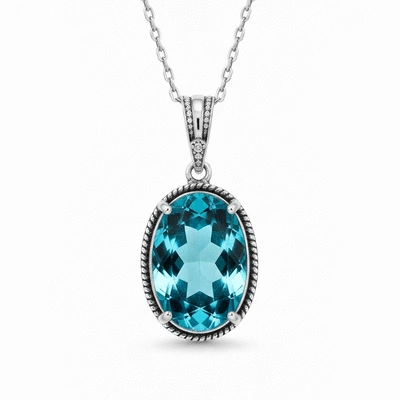 Elegant blue topaz pendant necklace on a clean background