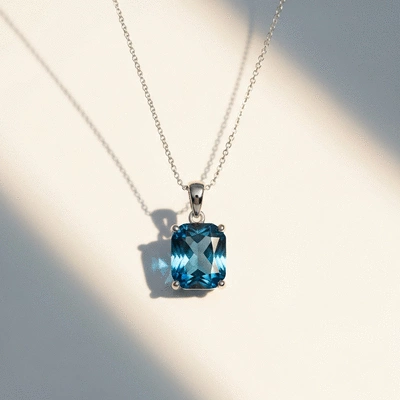 Elegant blue topaz pendant necklace on a clean white background