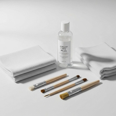 Jewelry care kit with soft cloths and mild cleaning solution