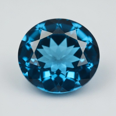 Close-up of a blue topaz gemstone with light reflecting off its facets
