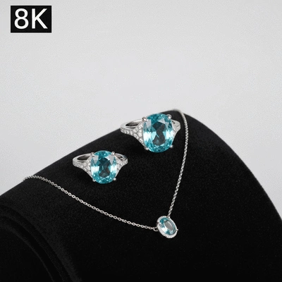 Aquamarine ring and necklace set on a dark velvet background