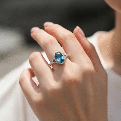 Elegant blue topaz ring on a hand, showcasing its durability for daily wear